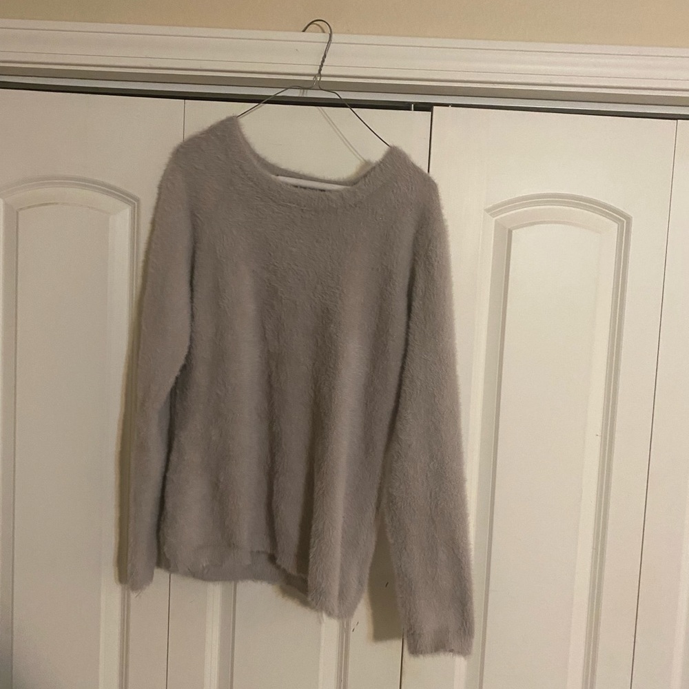 A light gray faux fur sweater